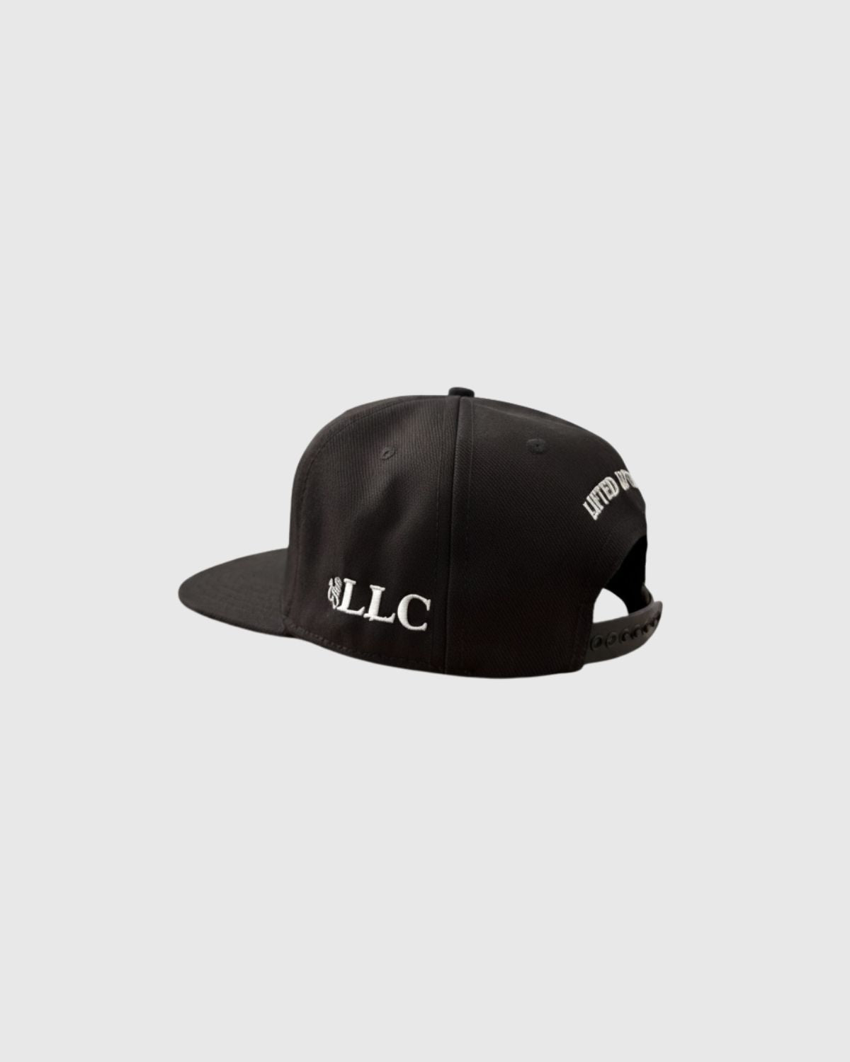 The Above The Rim black snapback hat with The LLC logo embroidered on the side of the black snapback hat. The letters of the LIFTED LAWYERS are visible on the back.