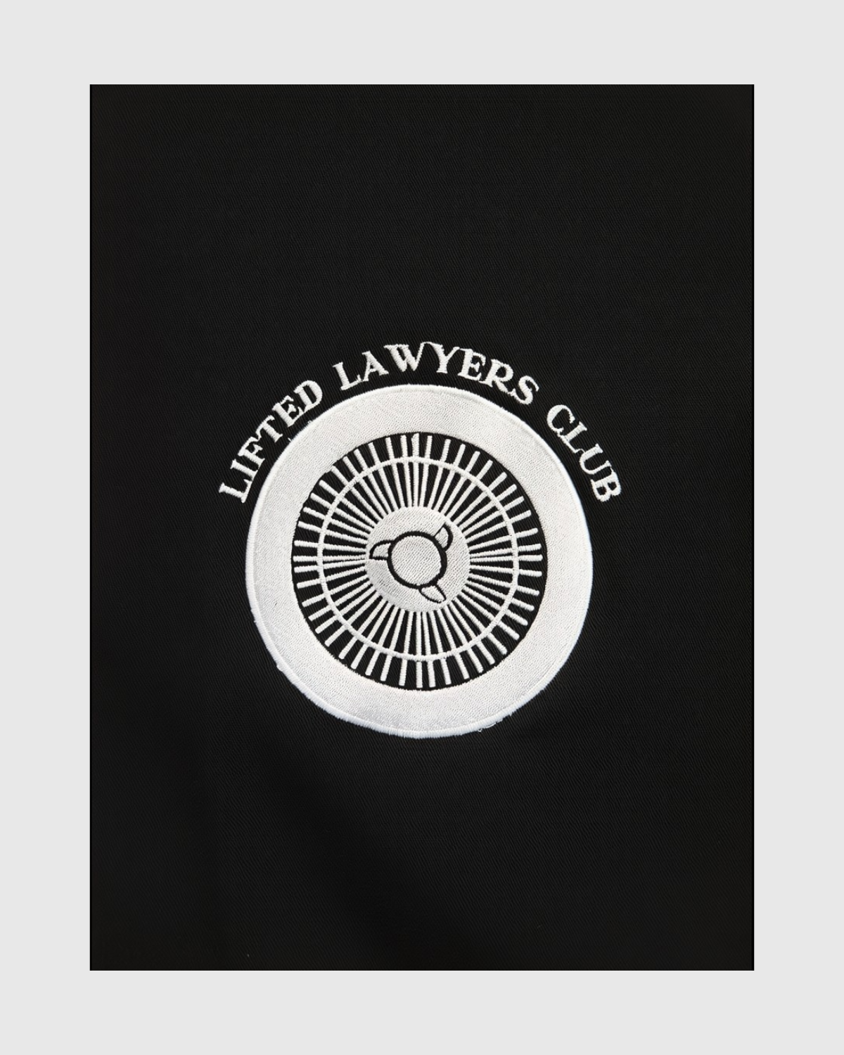 Car_Club_Shirt_Wheel Logo Embroidered Close-Up (Black)