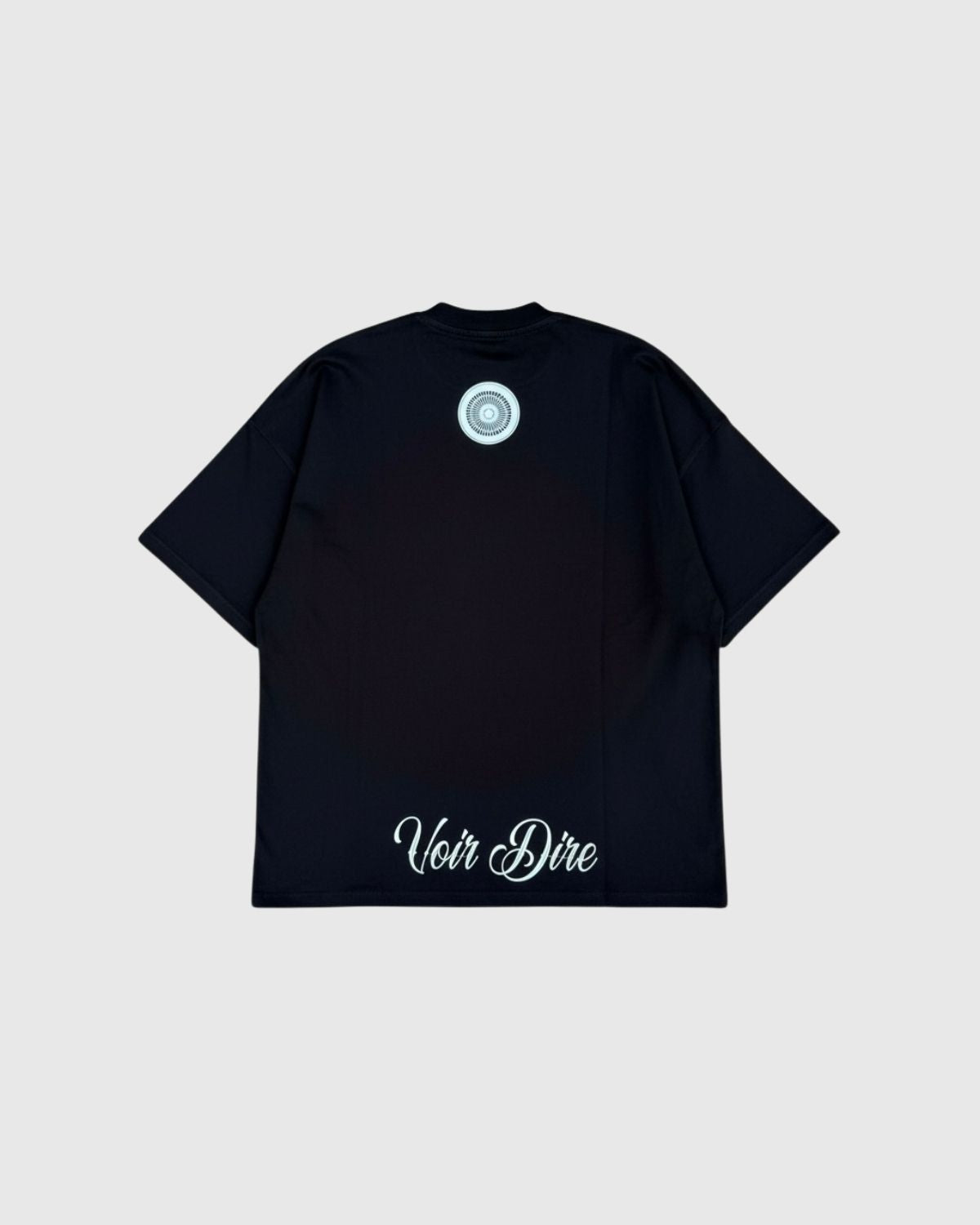 Heritage t-shirt with 'Voir Dire' text on a light gray background (Black)